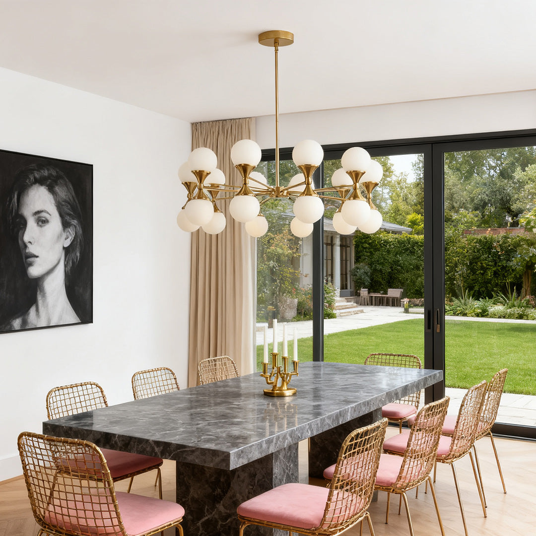 Bubble glass chandeliers in a linear design, featuring many clear crystal orbs and a polished chrome finish over a modern dining table.