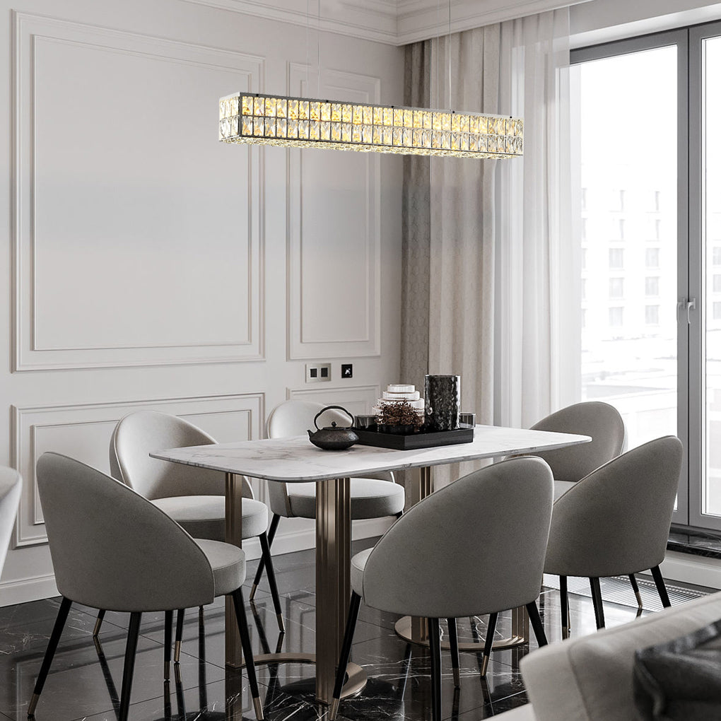 Linear crystal light providing a luxurious glow to a modern dining area with gray chairs.