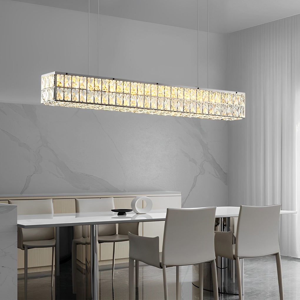 Linear crystal light fixture enhancing the ambiance of a minimalist dining room with marble walls.