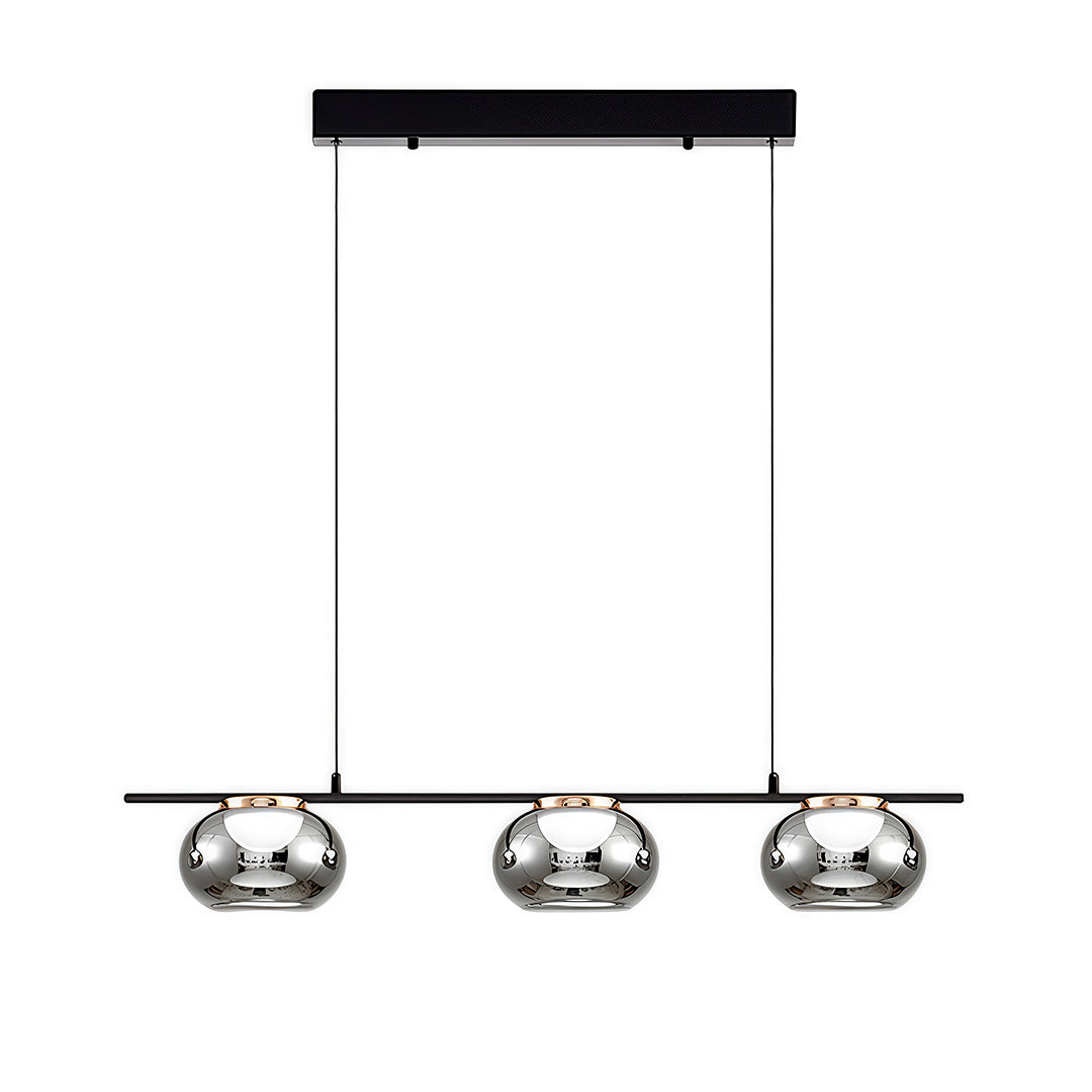 Linear gray glass pendant light with three dome shades suspended from black rectangular canopy.