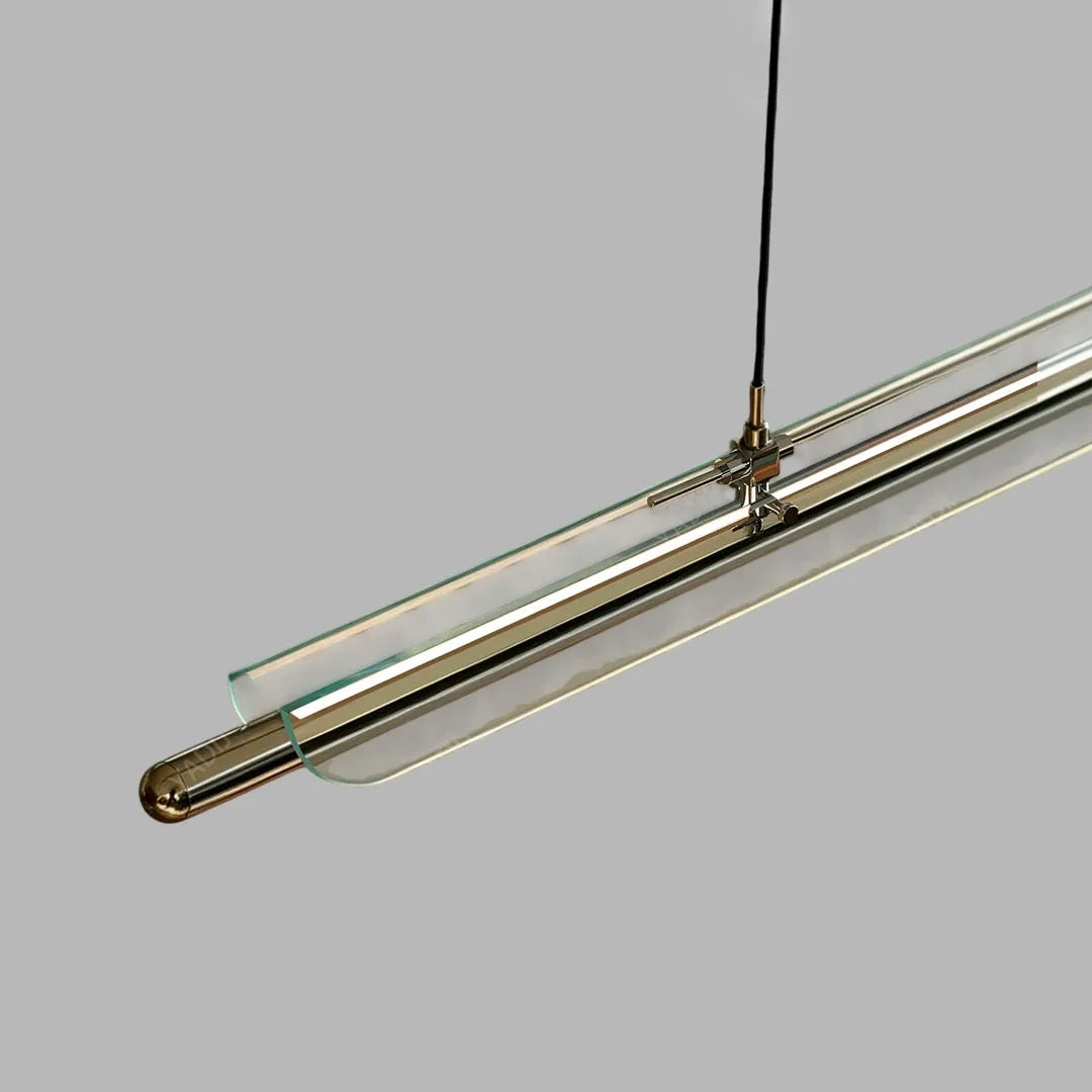 Close-up of a slim linear LED pendant light with a metallic frame and integrated light strip.