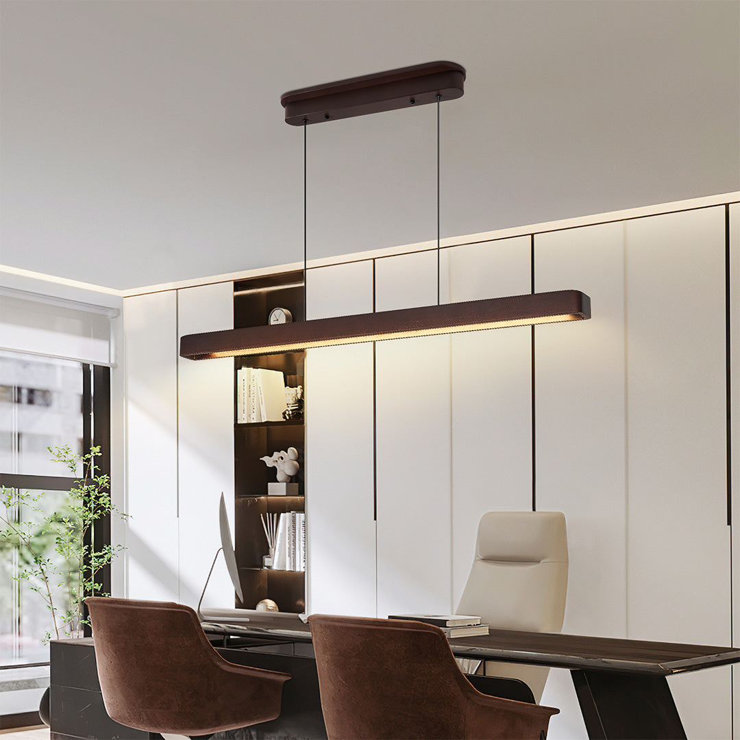 Elegant linear LED pendant lighting hanging above dining table, combining functionality and modern design.