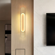 Linear led wall light providing elegant accent lighting in hallway with contemporary decor and dark architectural elements