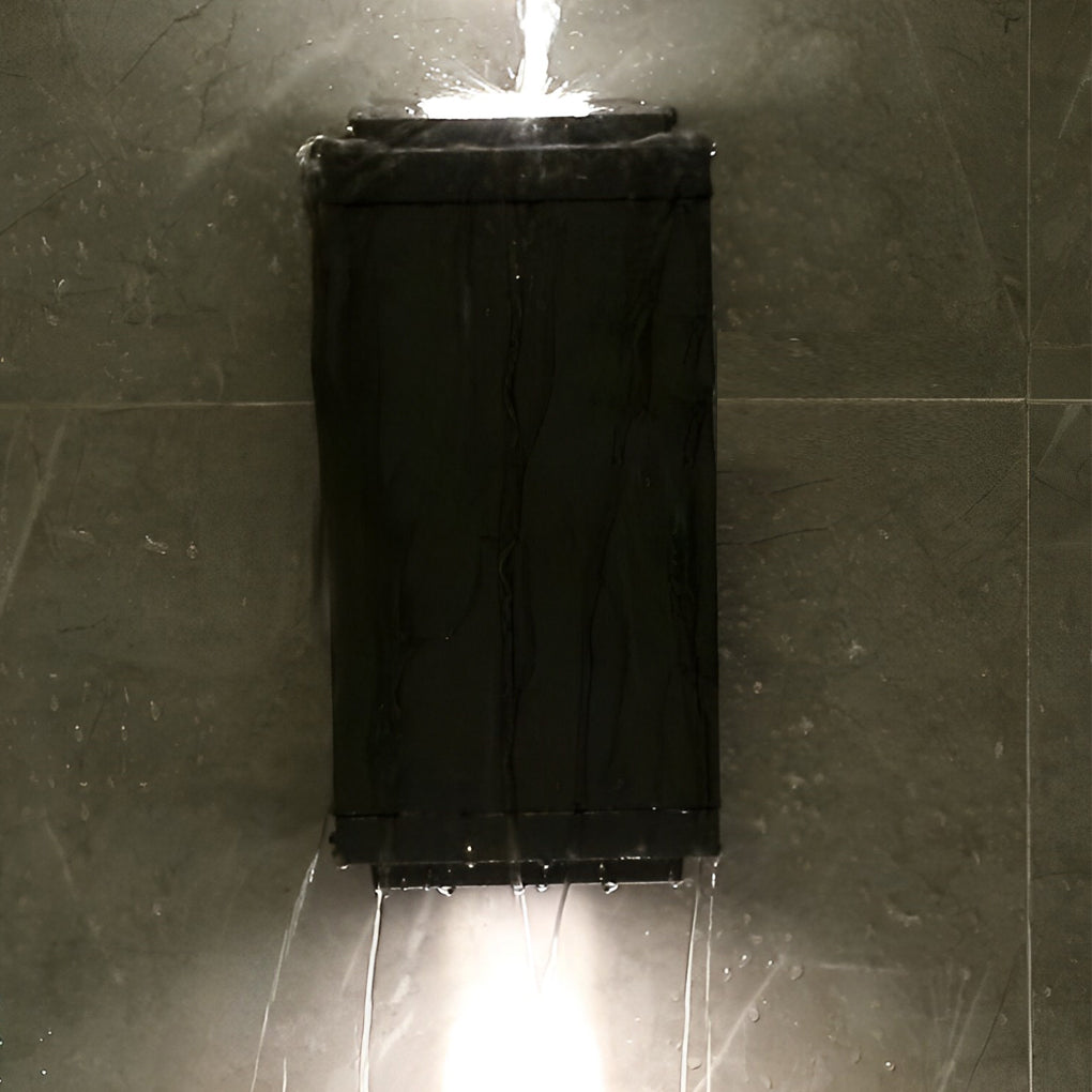 Minimalist narrow beam wall sconce illuminating a long covered walkway with linear lighting effect.