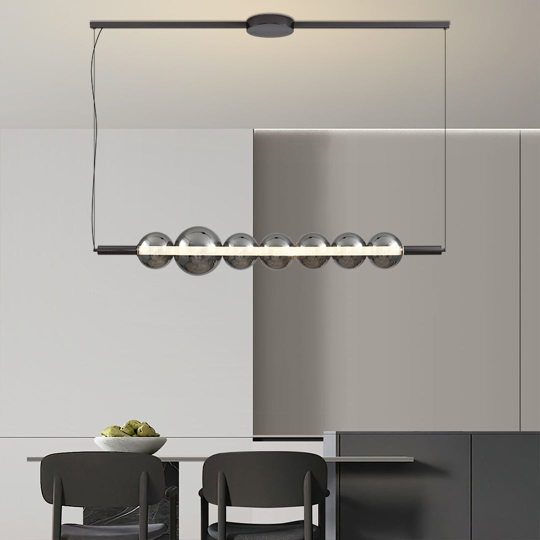 Sophisticated silver pendant light for kitchen island featuring linear arrangement in contemporary open-plan space