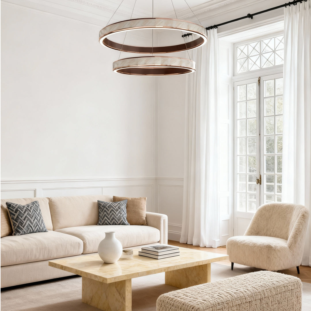 Bright living room featuring elegant linear suspension light fixtures with modern ring styling.