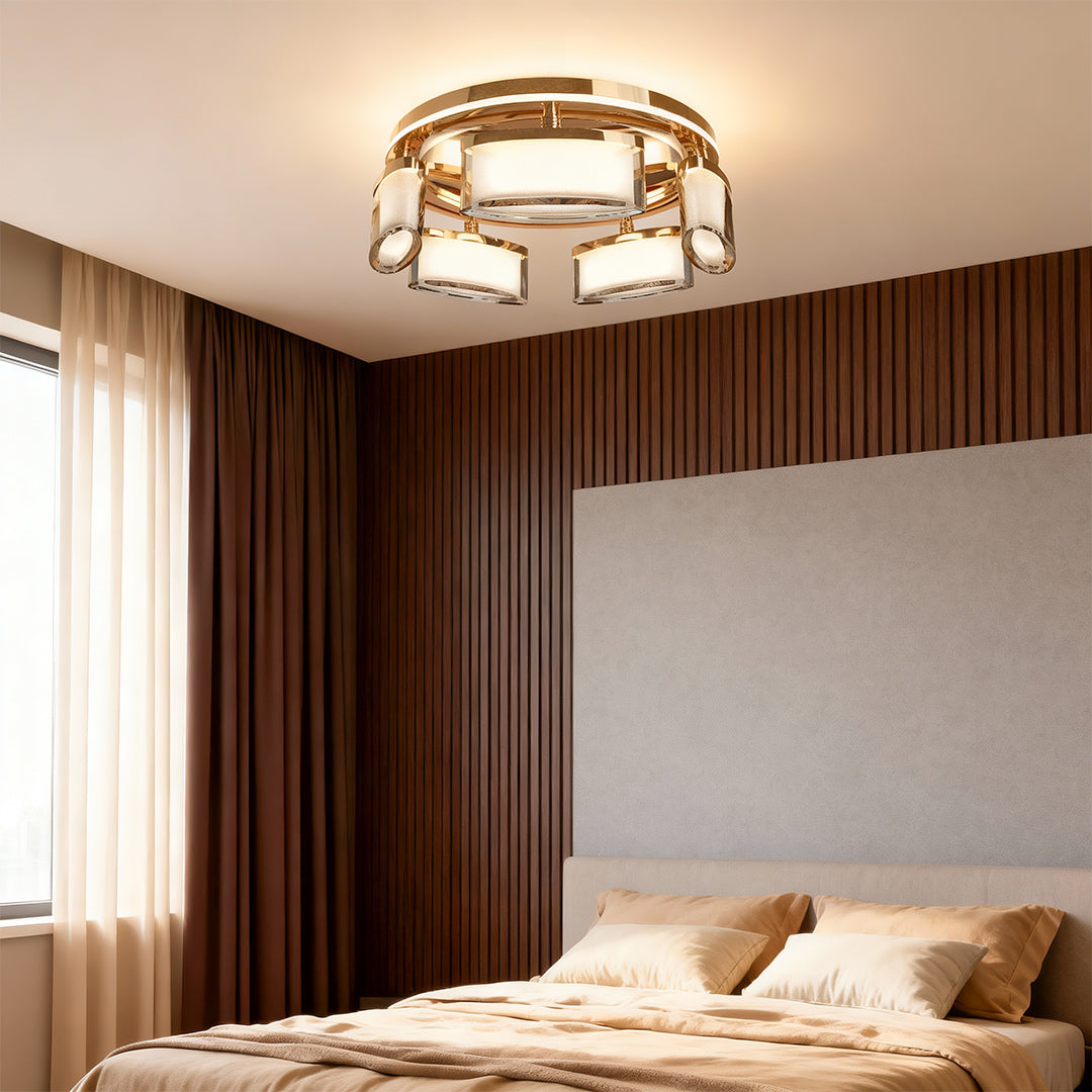 Linear suspension lighting fixture illuminating modern bedroom with wood paneling and minimalist design aesthetic