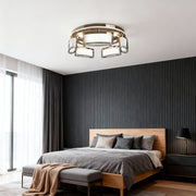 Linear suspension lighting as focal point in sophisticated bedroom with dark fluted wall and leather bed frame