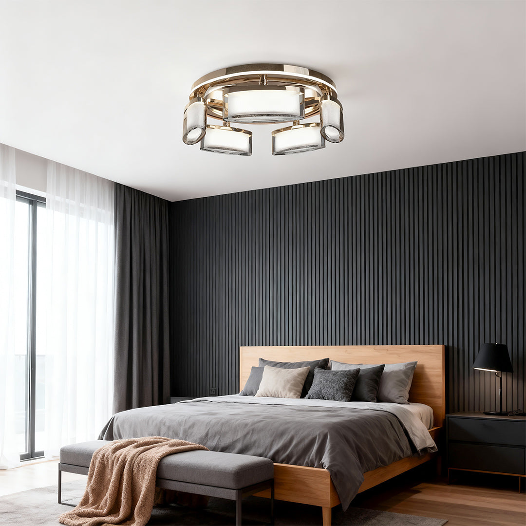 Linear suspension lighting as focal point in sophisticated bedroom with dark fluted wall and leather bed frame