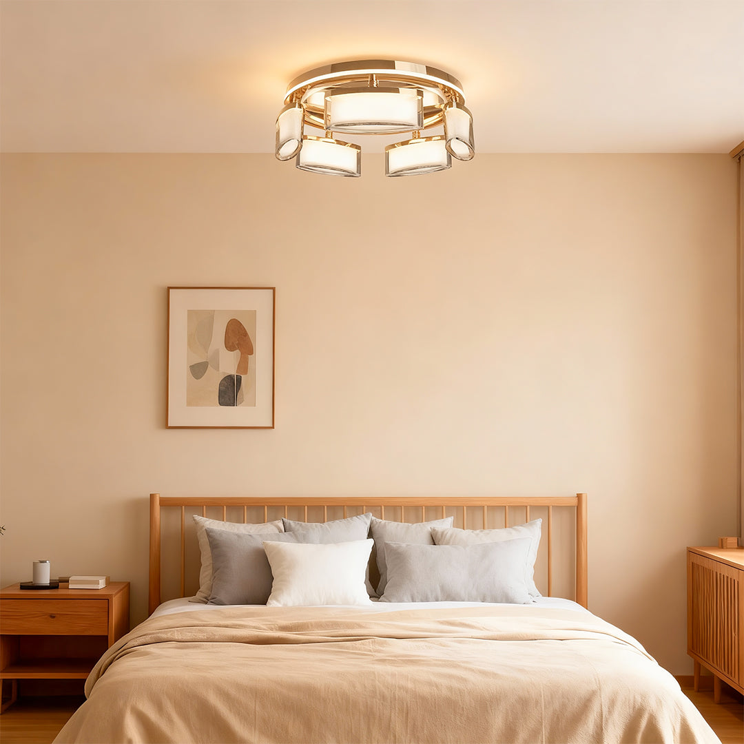 Linear suspension lighting providing warm glow in contemporary bedroom with wooden headboard and neutral decor