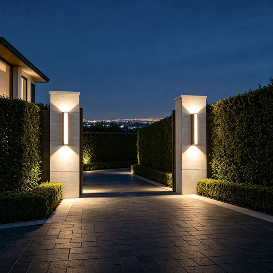 Linear up down wall light mounted beside modern entrance doorway with soft ambient illumination.