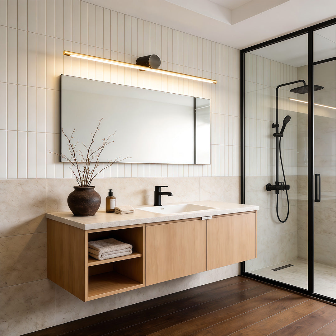 Slim linear vanity light bar installed above floating vanity and mirror