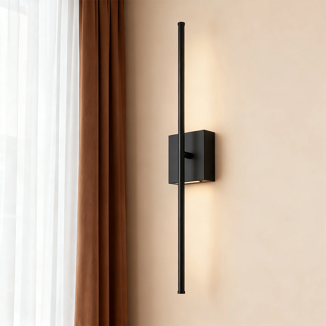 Linear wall lights near a curtain, offering soft and elegant illumination for a relaxed indoor ambiance.