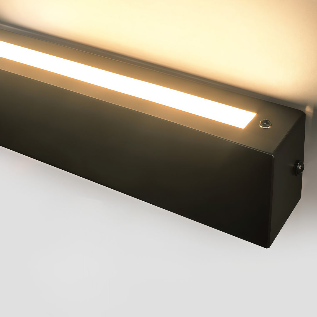Detailed view of linear wall sconces with integrated warm LED strip and modern black metal frame.