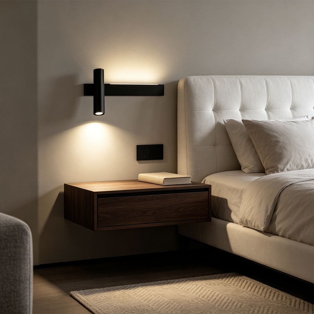 Modern linear wall sconces installed beside a bed with warm ambient lighting in a minimalist bedroom.
