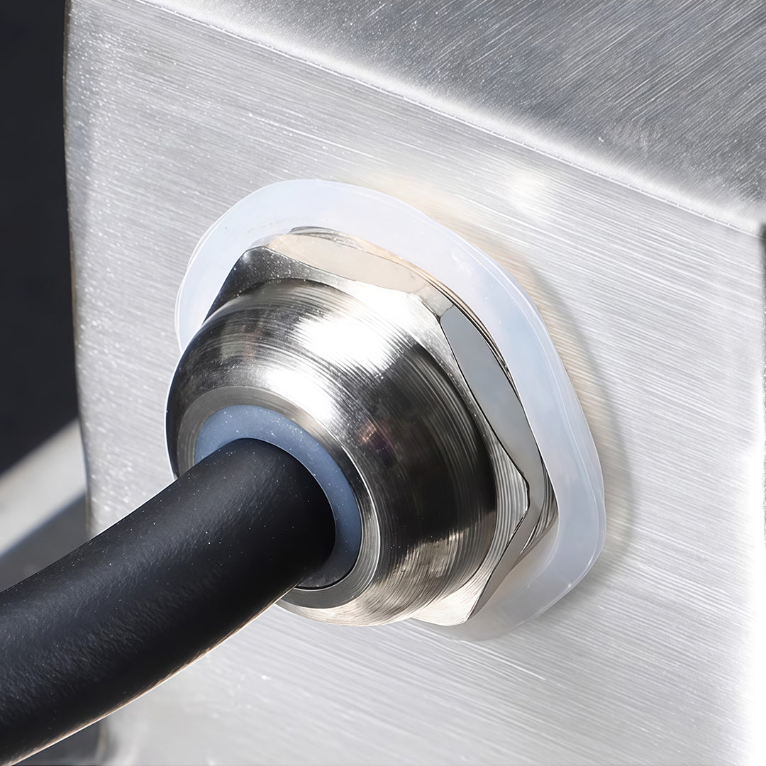 Waterproof cable connector on LED linear wall washer light housing.