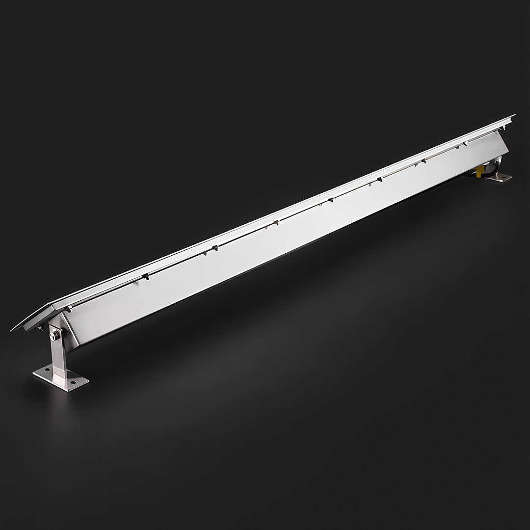 Side view of aluminum linear wall washer light on black background.