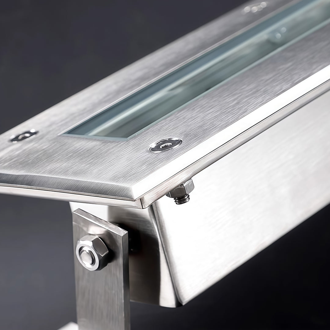 LED linear wall washer light under running water for waterproof testing.