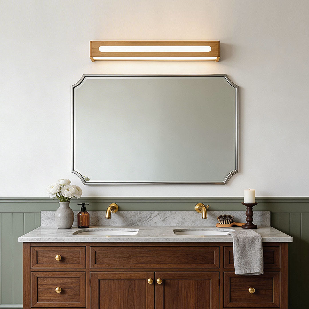 Linear wooden vanity mirror light for a modern farmhouse bathroom vanity.