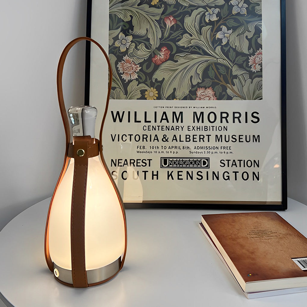 Liquor bottle lights with a close-up of their glowing interior and leather strap.