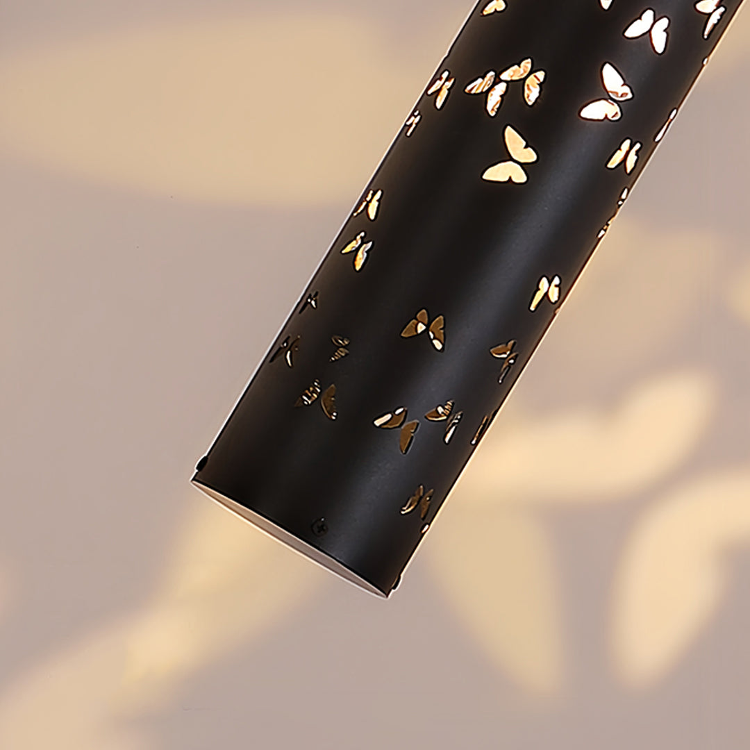 Modern living room featuring small black pendant light casting beautiful butterfly shadows