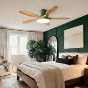 Modern living room ceiling fan with lights installed above a cozy bedroom-style living space, blending wood blades with warm ambient lighting.