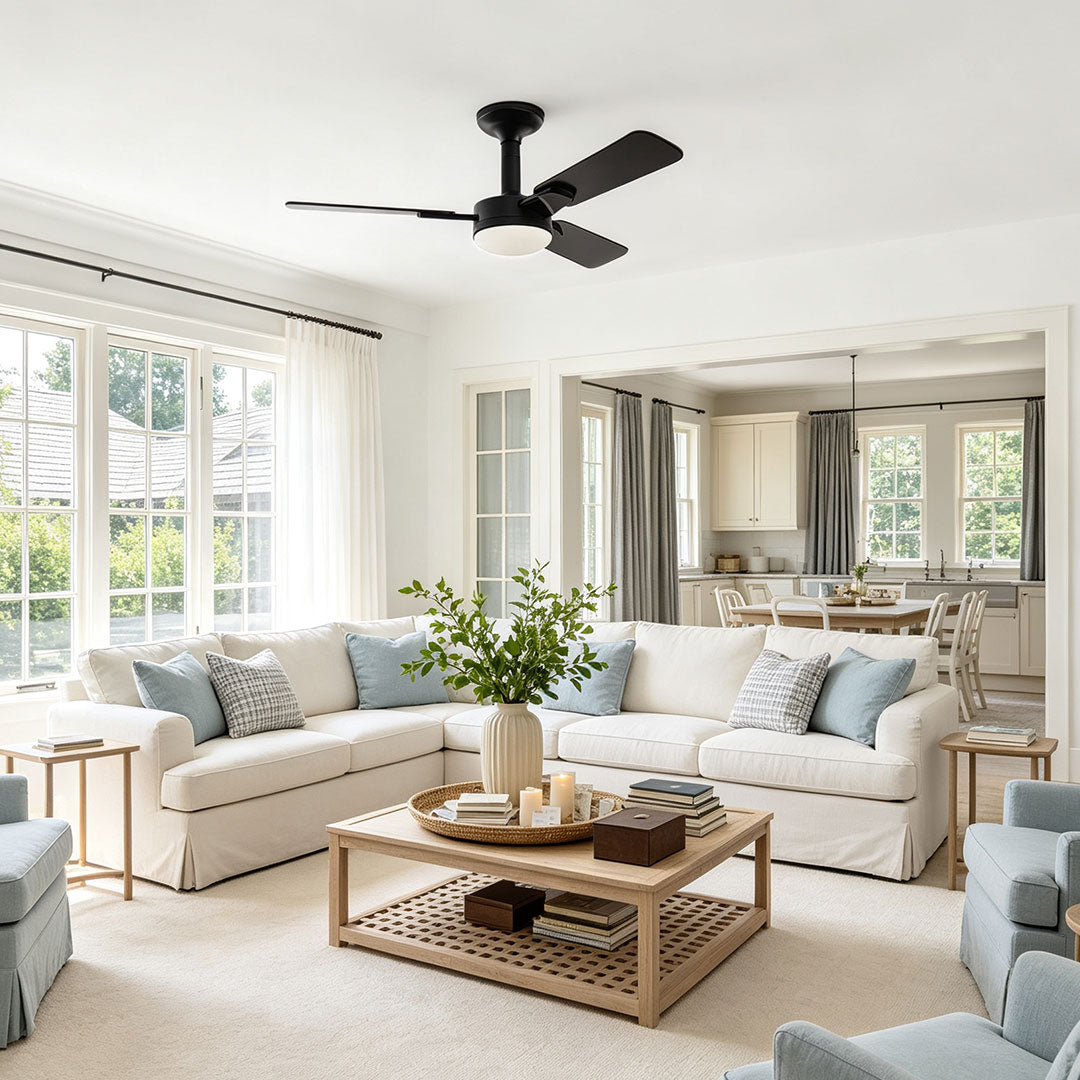 Copper ceiling fan with light featuring black blades in a spacious contemporary living room.