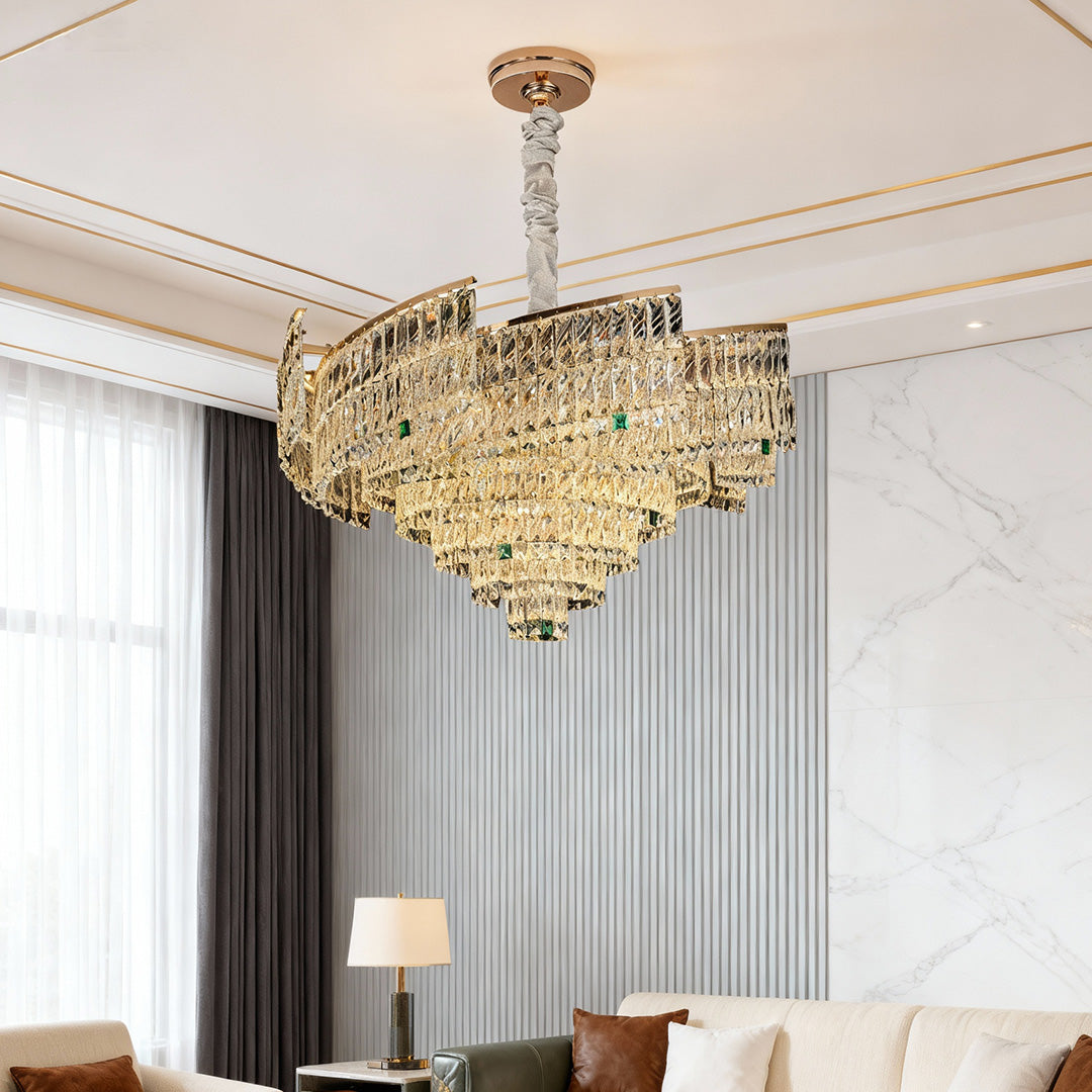 Living area decorated with crystal pendant chandelier reflecting warm tones.