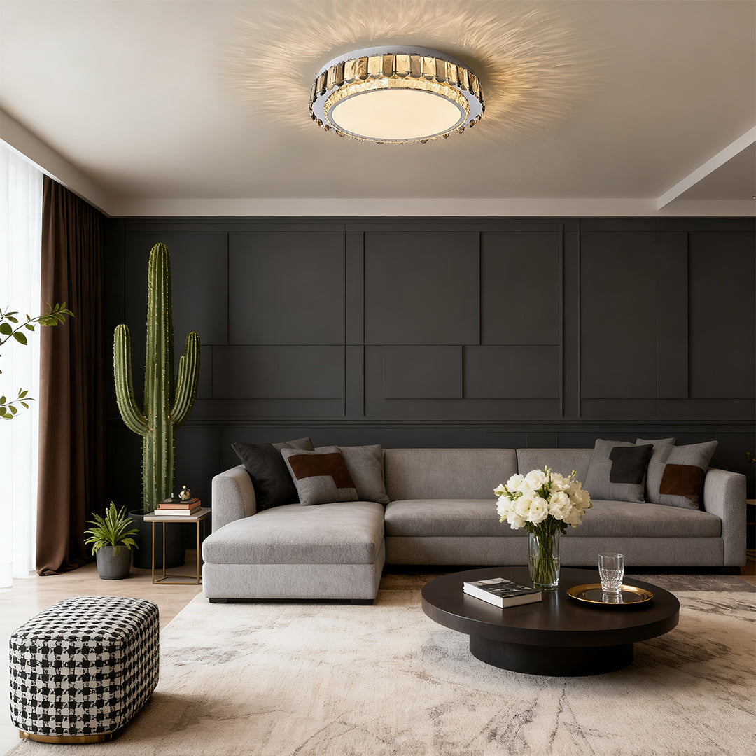 Round LED flush mount light illuminating a stylish living room.