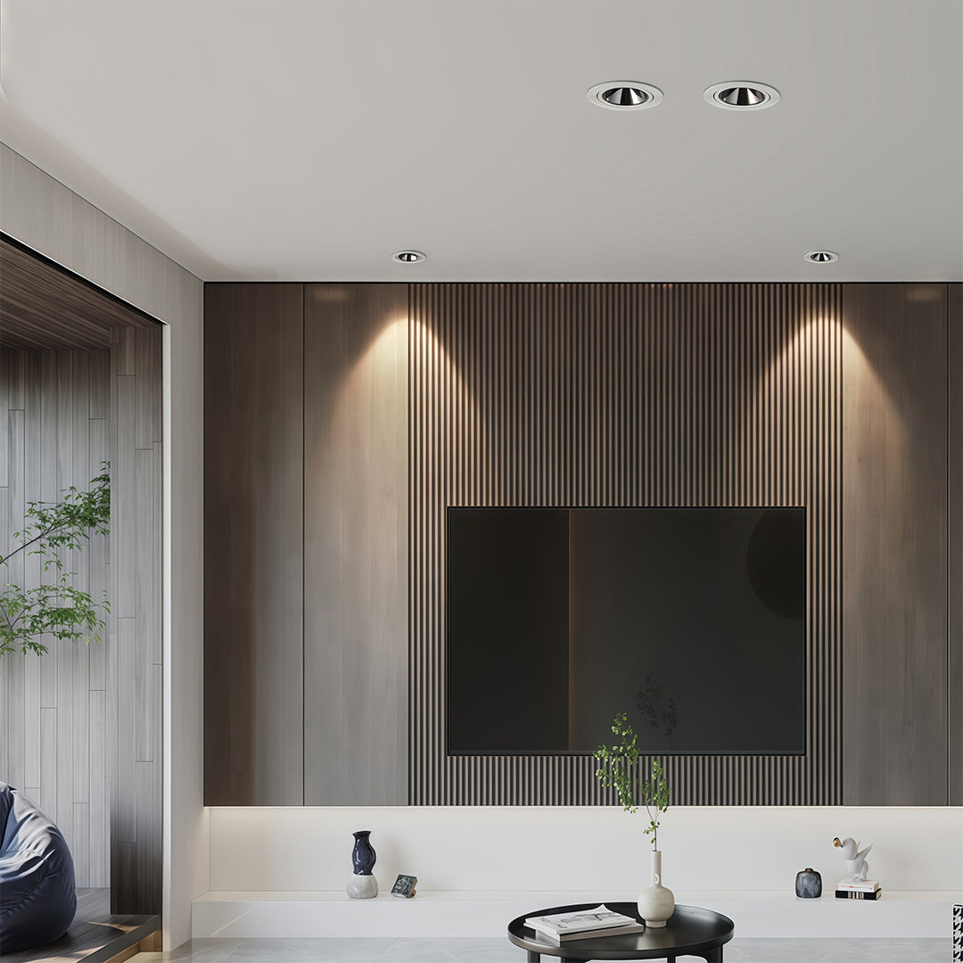 Modern living room accent wall with slatted wood, illuminated by adjustable directional recessed downlight fixtures.