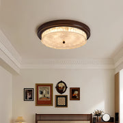 Wood flush mount ceiling light installed in elegant living room with classic interior design