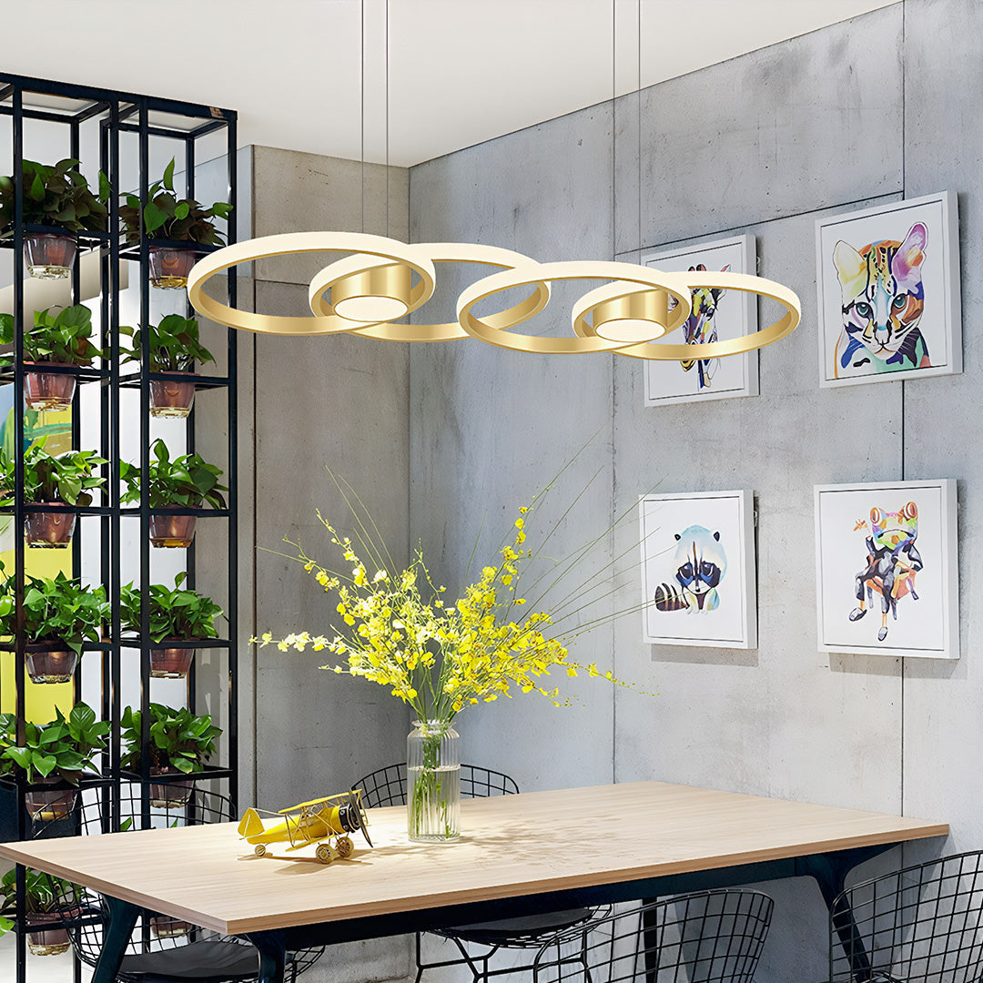 Elegant gold chandelier lamp with three rings, stylish pendant light in a modern living space