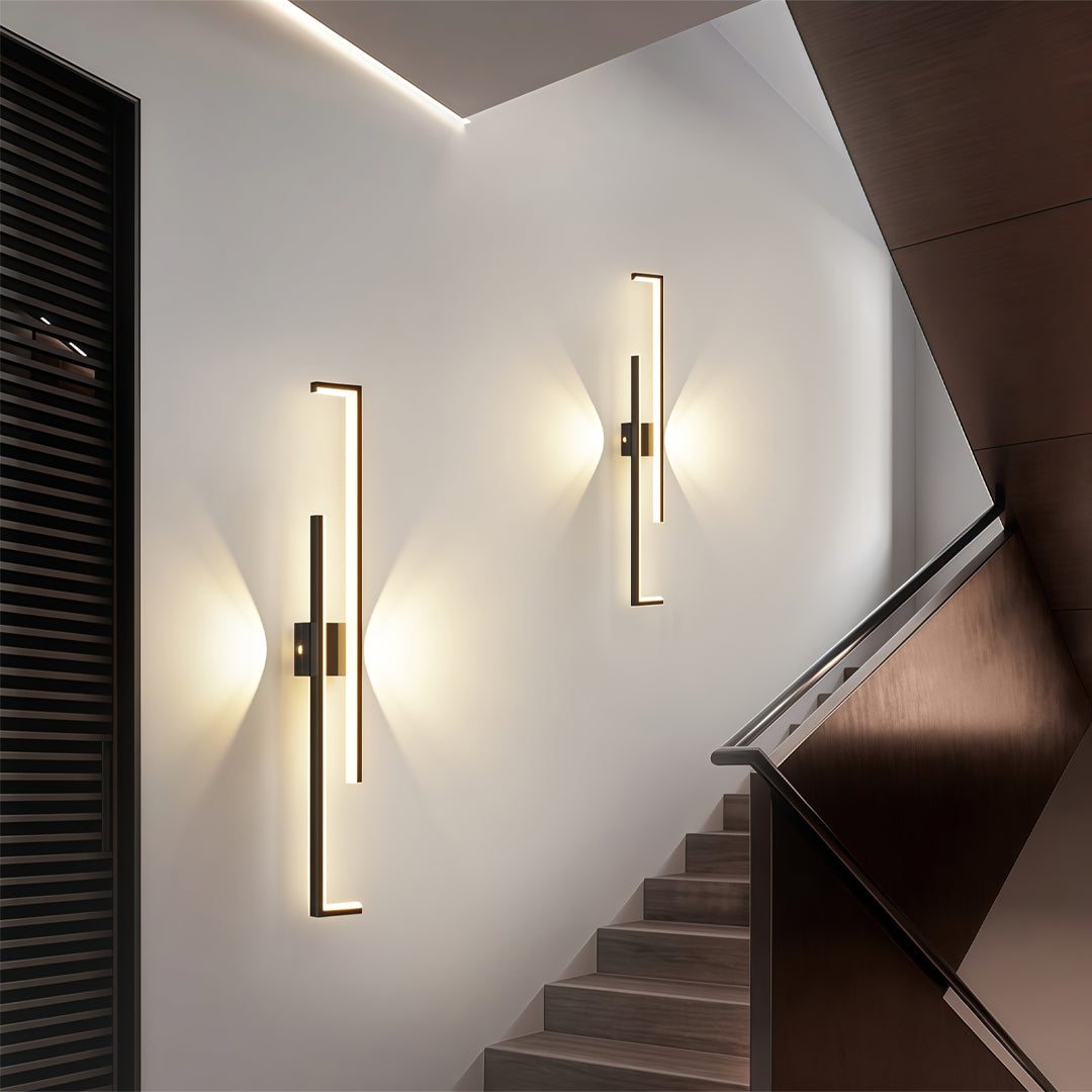 Wall art led lights mounted in a living room with contemporary framed artwork.