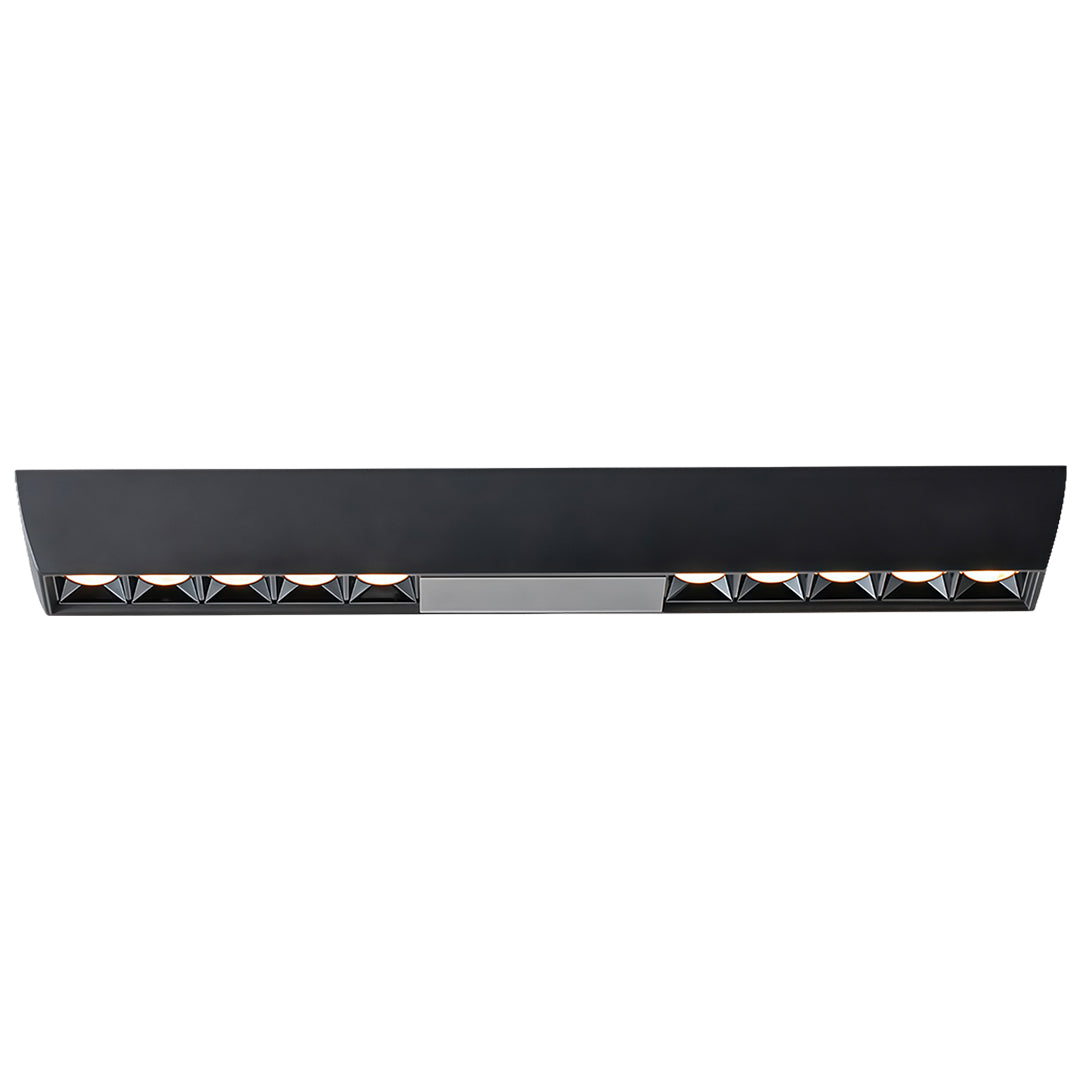 Long black surface-mounted light bar fixture with multiple recessed anti-glare square downlights.