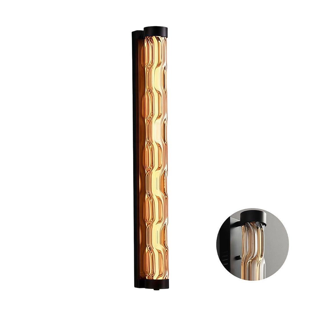 Long LED linear wall light with a black frame and amber textured glass diffuser.