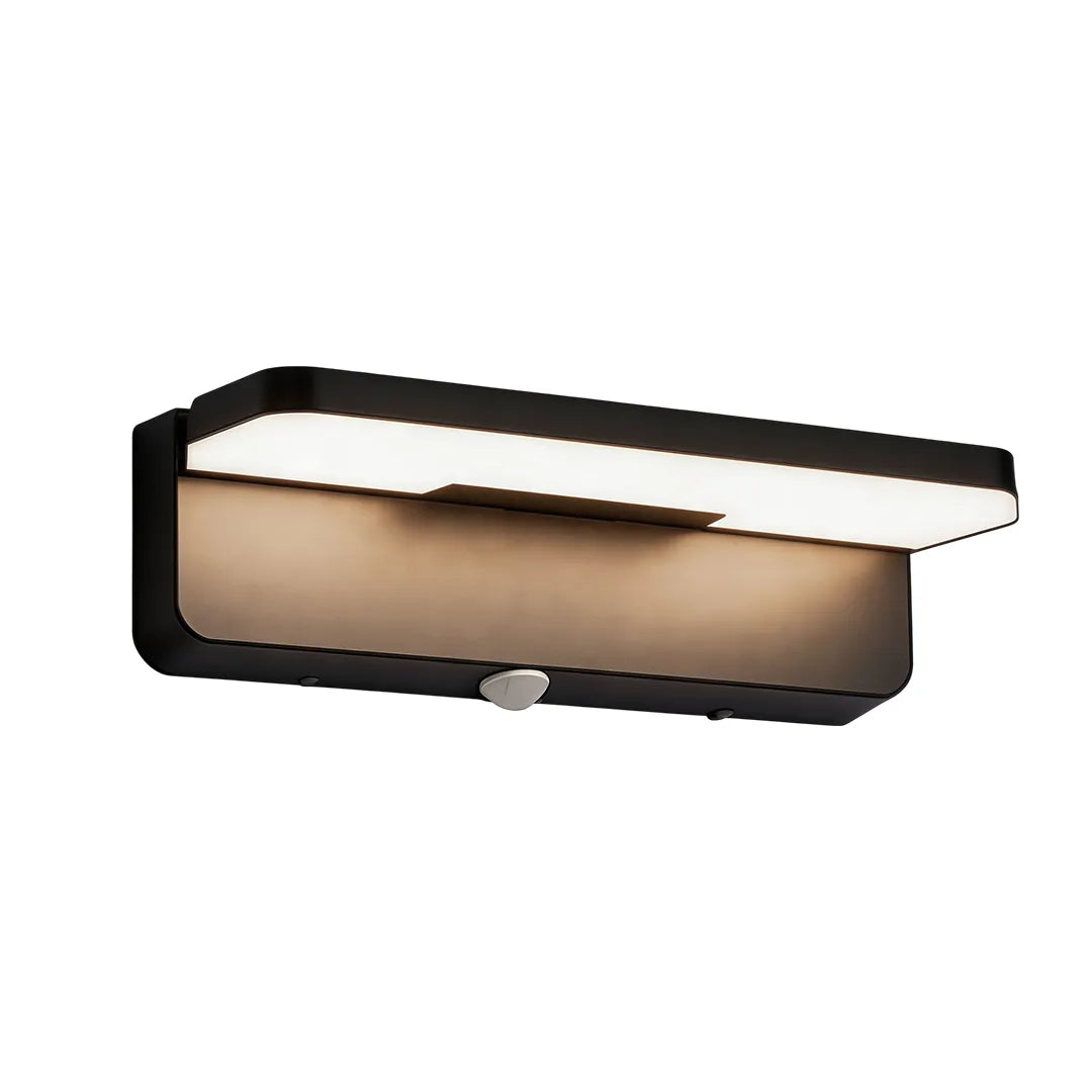 Long black outdoor wall light with integrated motion sensor and warm LED glow