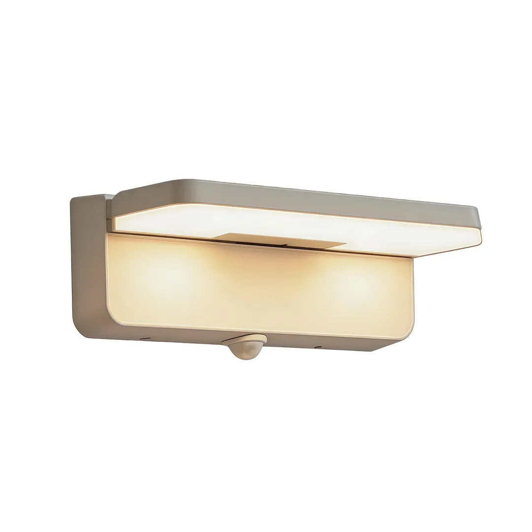 Long silver outdoor wall light with motion sensor and warm LED illumination