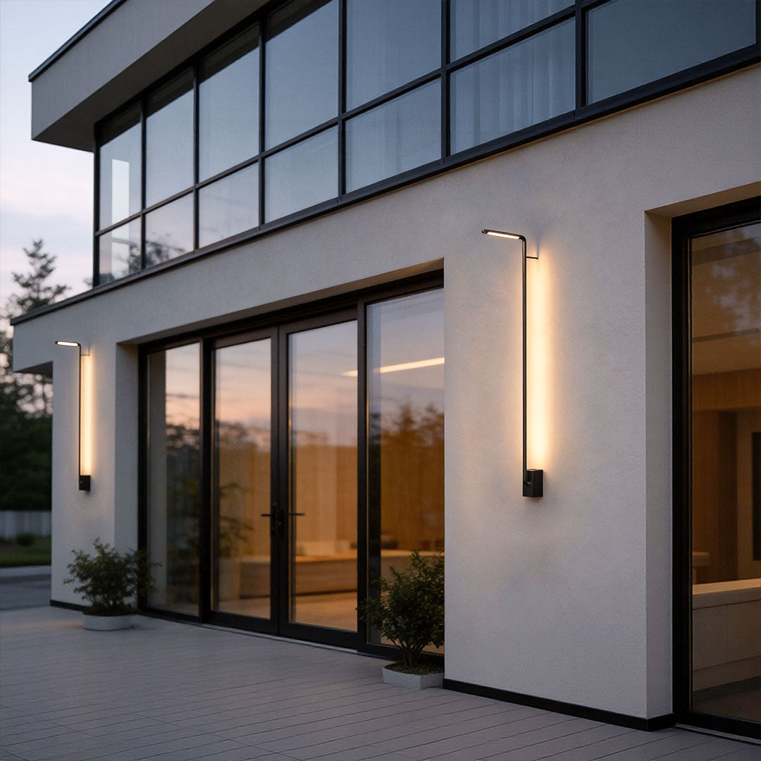 Long outdoor wall lights with a contemporary linear design, illuminating a balcony area.