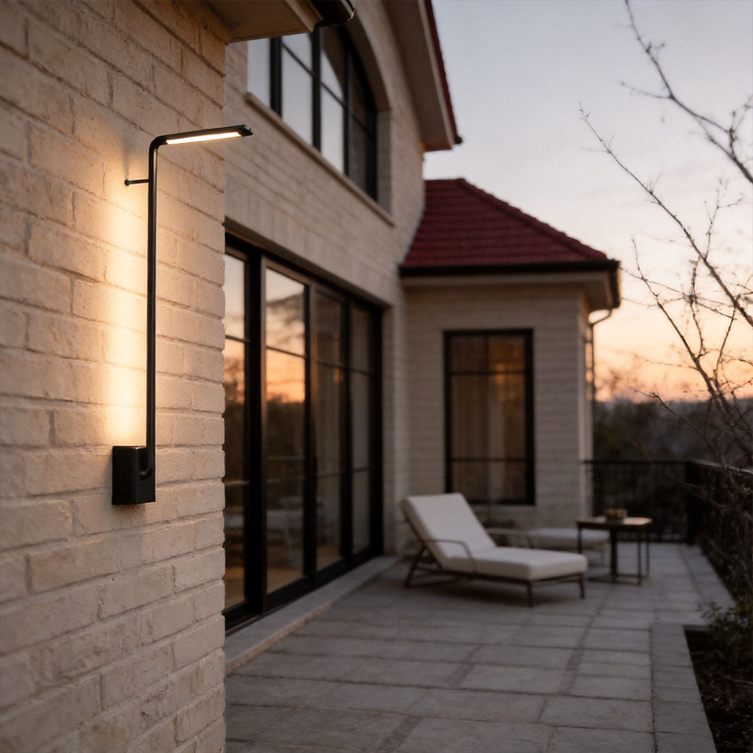 Long outdoor wall lights with a modern linear design, providing warm illumination near a patio.