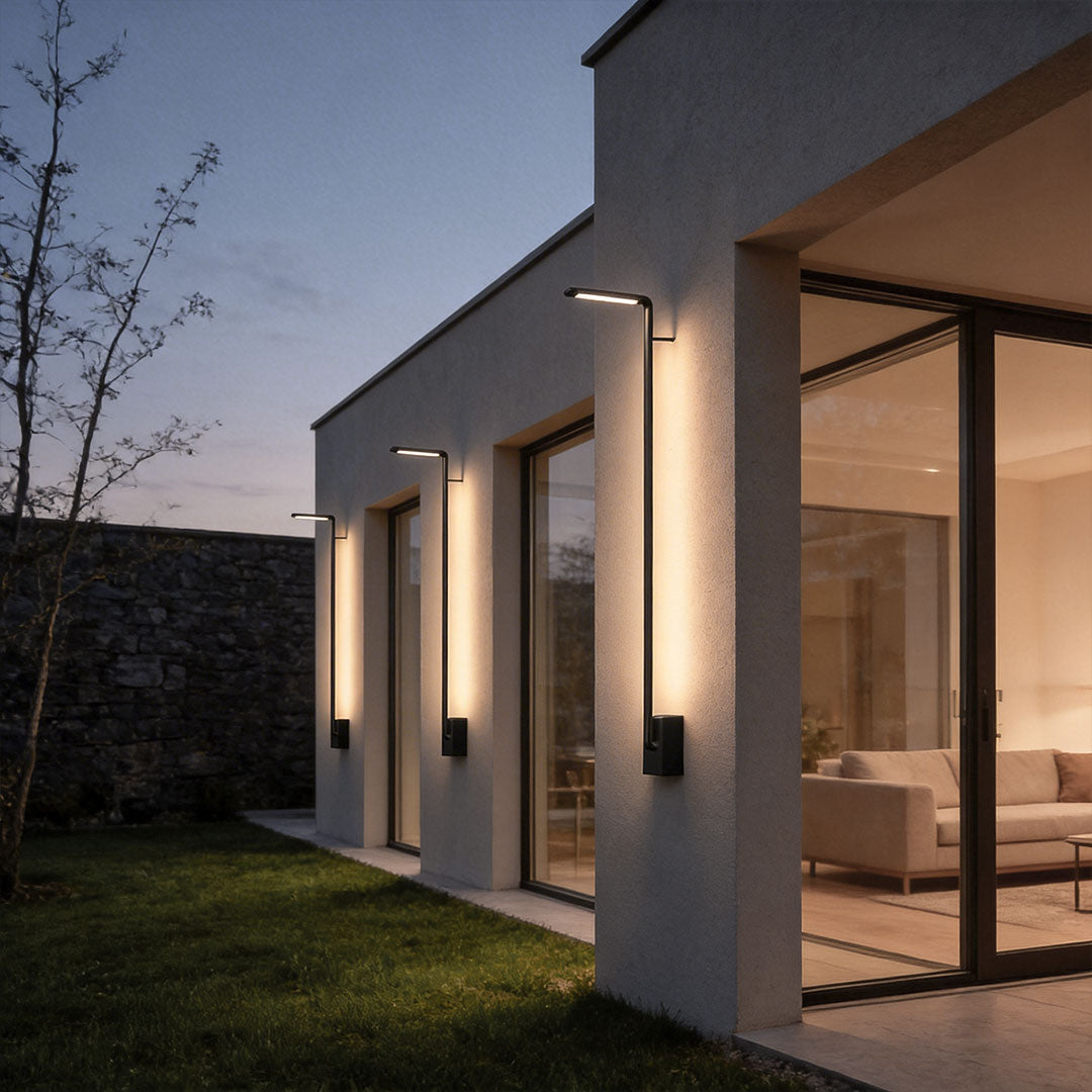 Long outdoor wall lights with a sleek linear design, enhancing a modern house exterior.