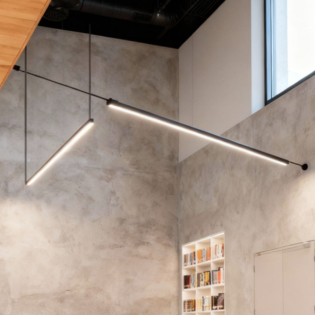 A Nordic minimalist long pendant light fixture with a sleek linear design, perfect for kitchen islands, dining tables, and modern interiors, providing soft and elegant illumination.