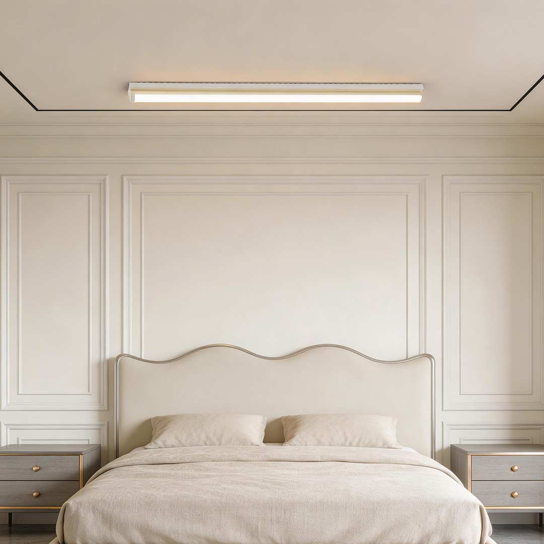 Long strip ceiling light with a sleek design, enhancing a contemporary bedroom.