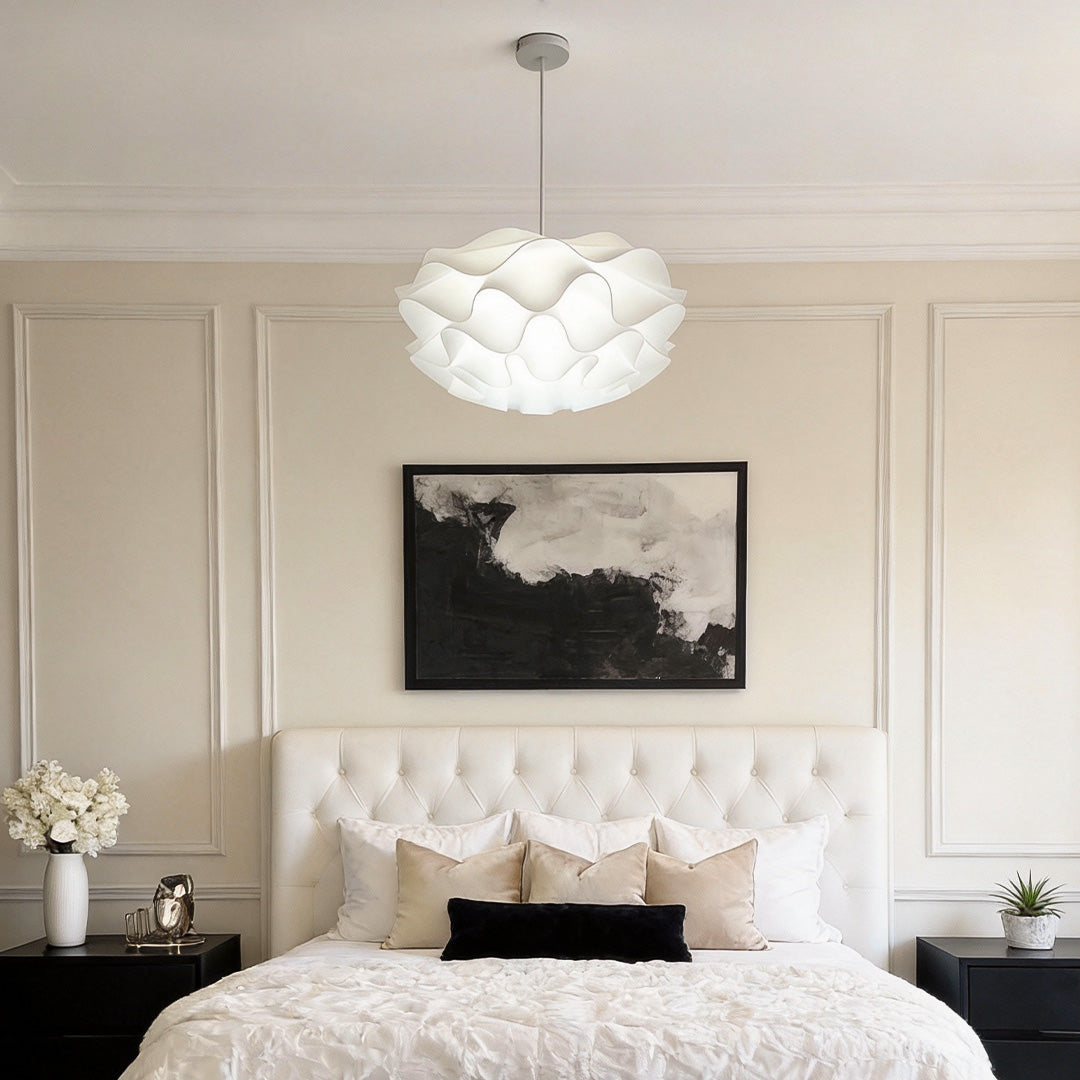 Lotus flower pendant light illuminating a modern bedroom with soft, ambient glow.