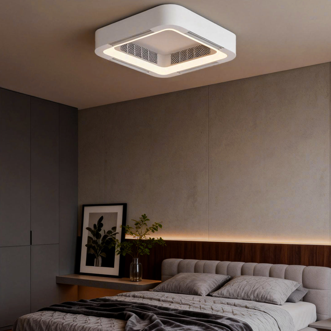 Square low profile bladeless ceiling fan with light above a cozy bedroom