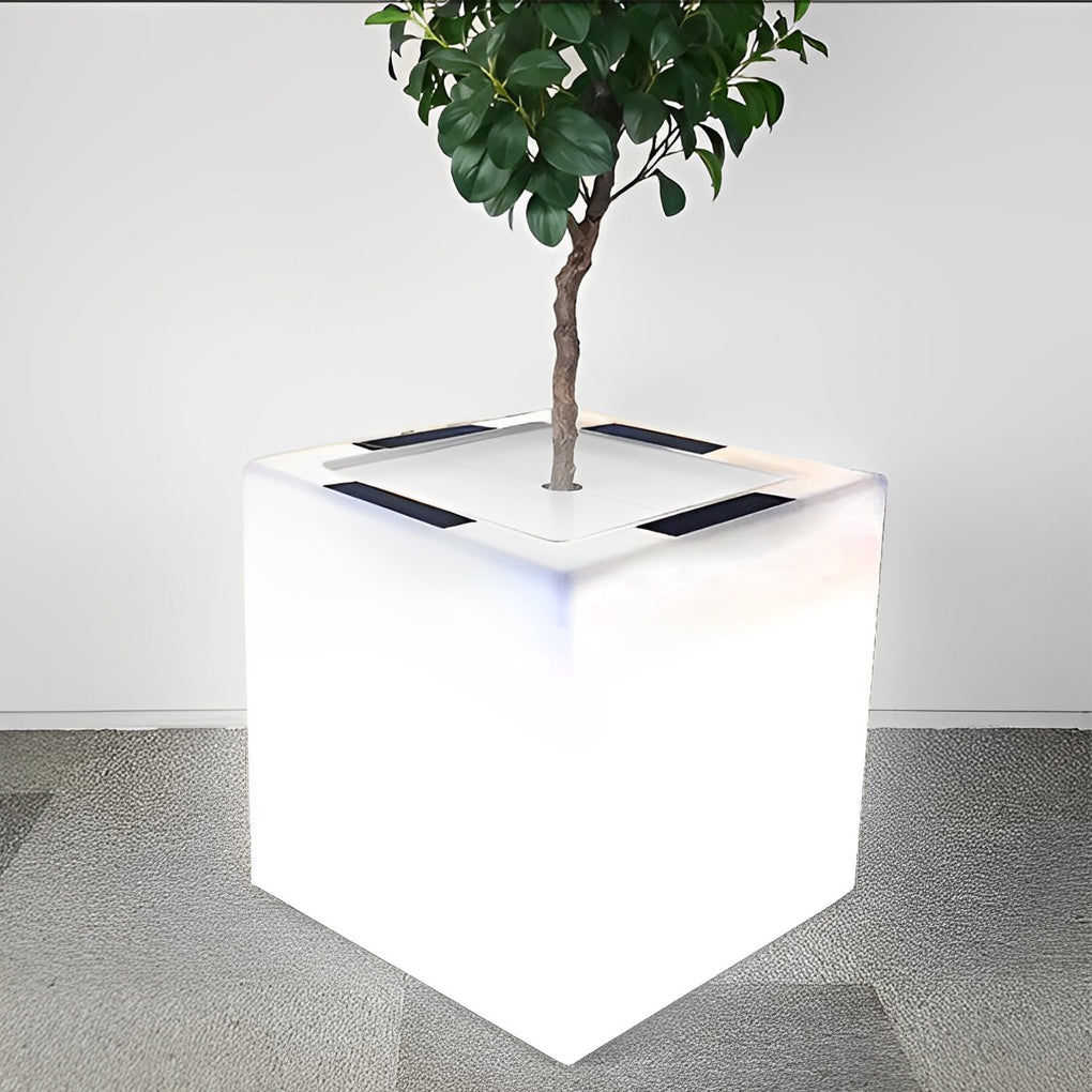 Luminous flower pots with a modern design, providing soft light near a seating area.