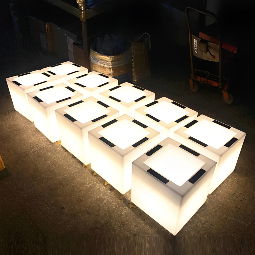 Luminous flower pots with a sleek design, illuminating a poolside area.