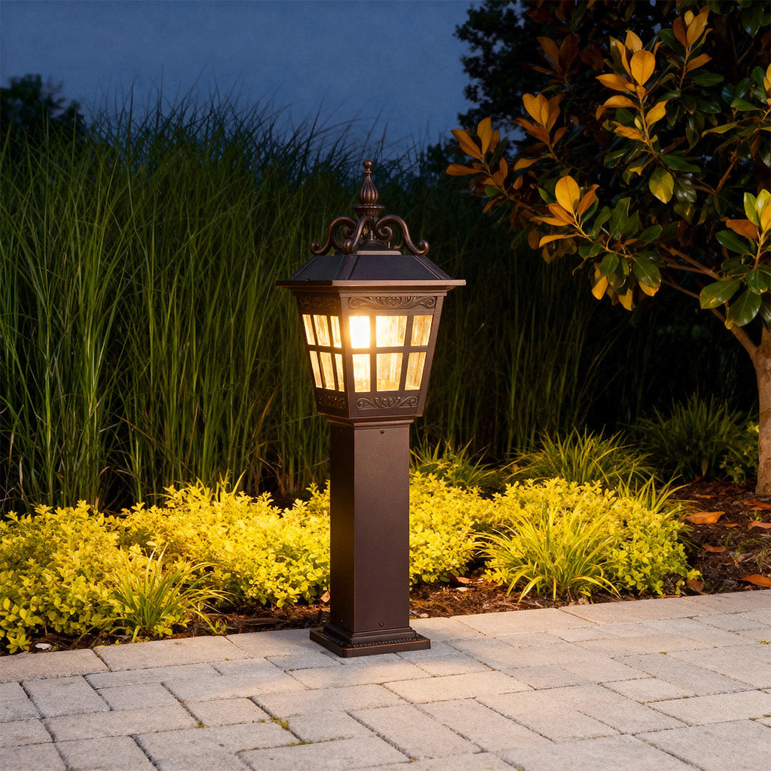 External bollard light in a lush garden setting, elegant and functional outdoor lighting