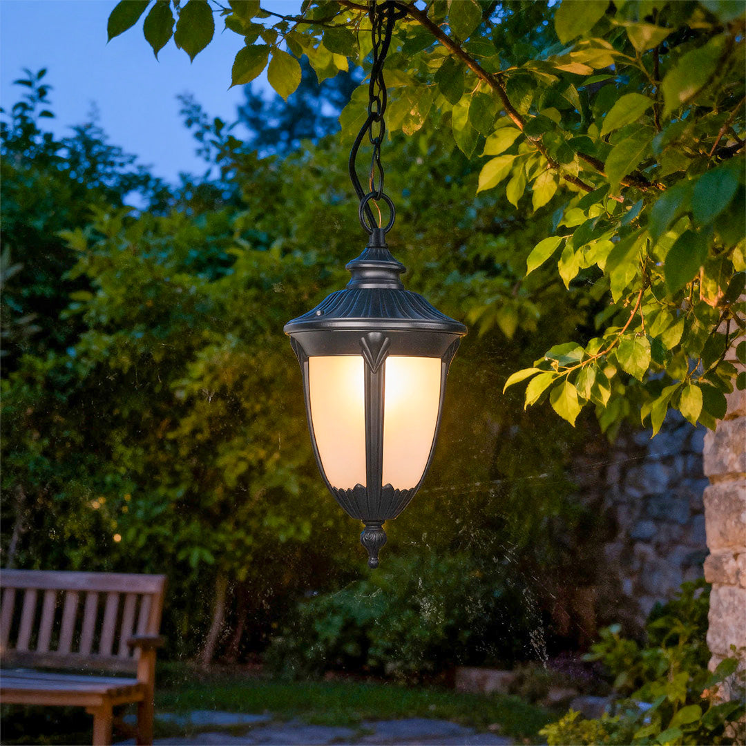 Outdoor porch pendant light in a lush garden setting, elegant and functional exterior lighting