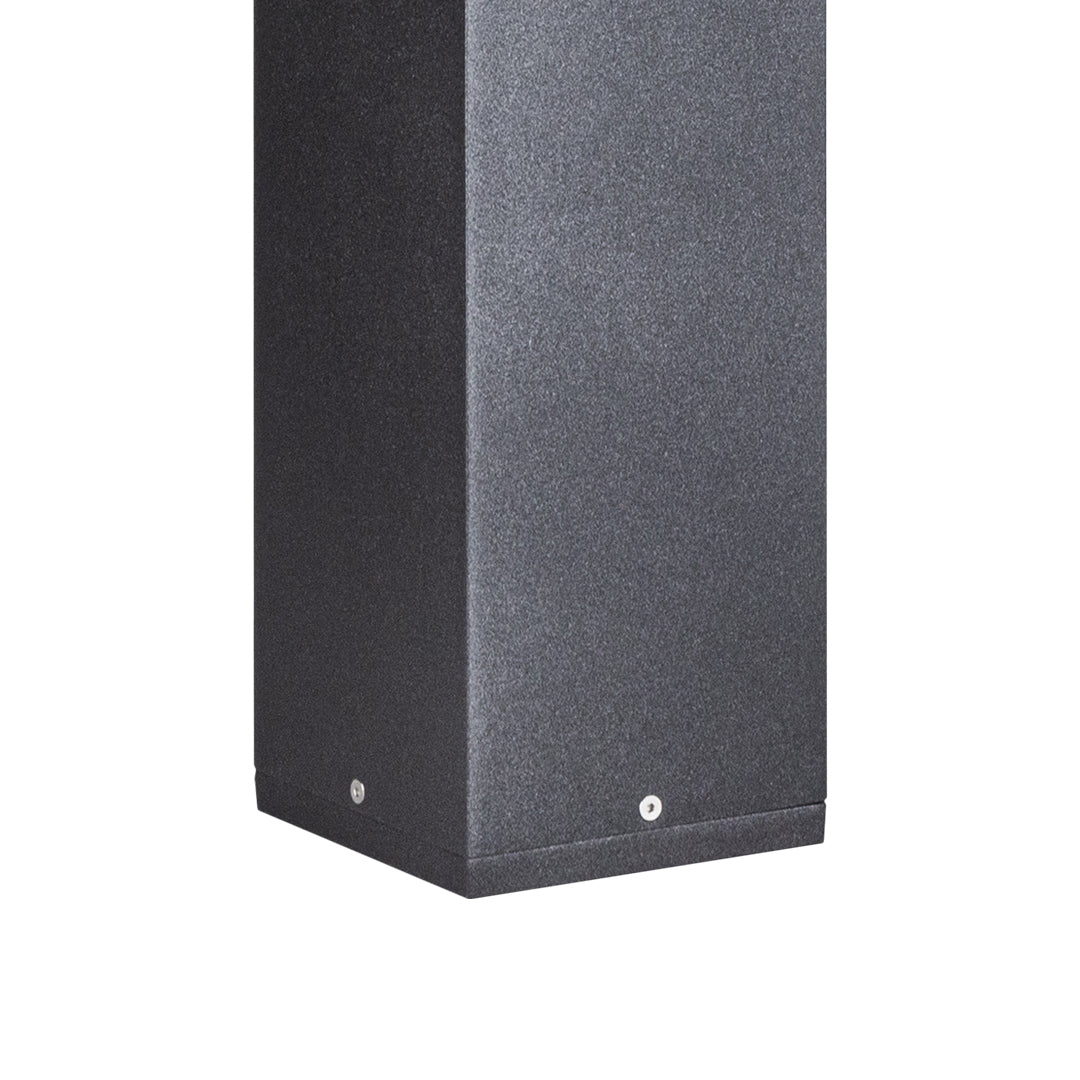 Square bollard lights creating uniform illumination in lush garden border setting