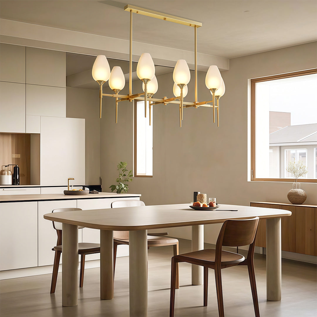 Luxurious glass modern chandelier with glass shade chandelier styling providing elegant illumination above modern dining table.